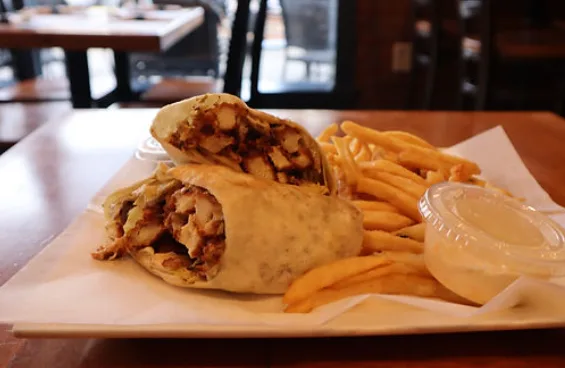 Chicken caesar wrap with fries and ranch dressing