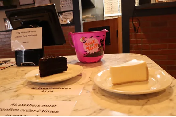 Chocolate cake and cheesecake on plates