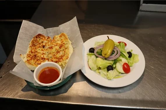 Garlic bread and marinara with a side salad